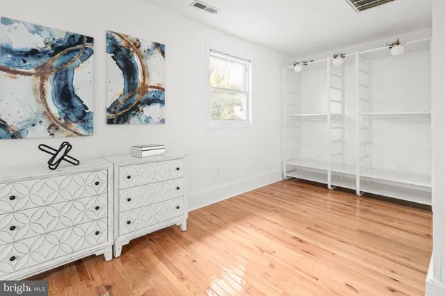a kitchen with a sink cabinets and window