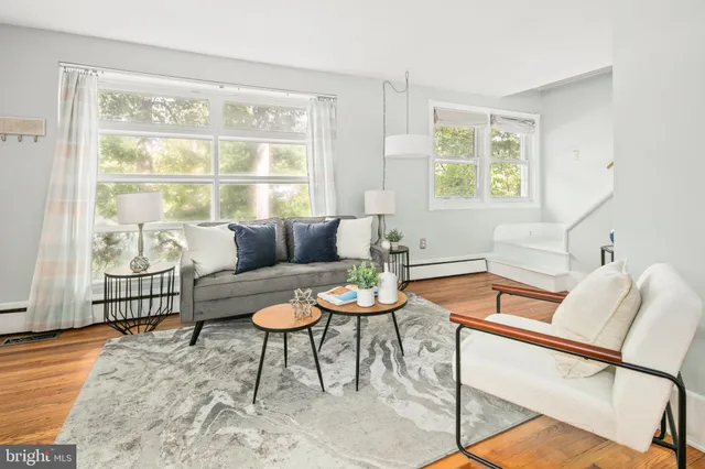a living room with furniture and a window