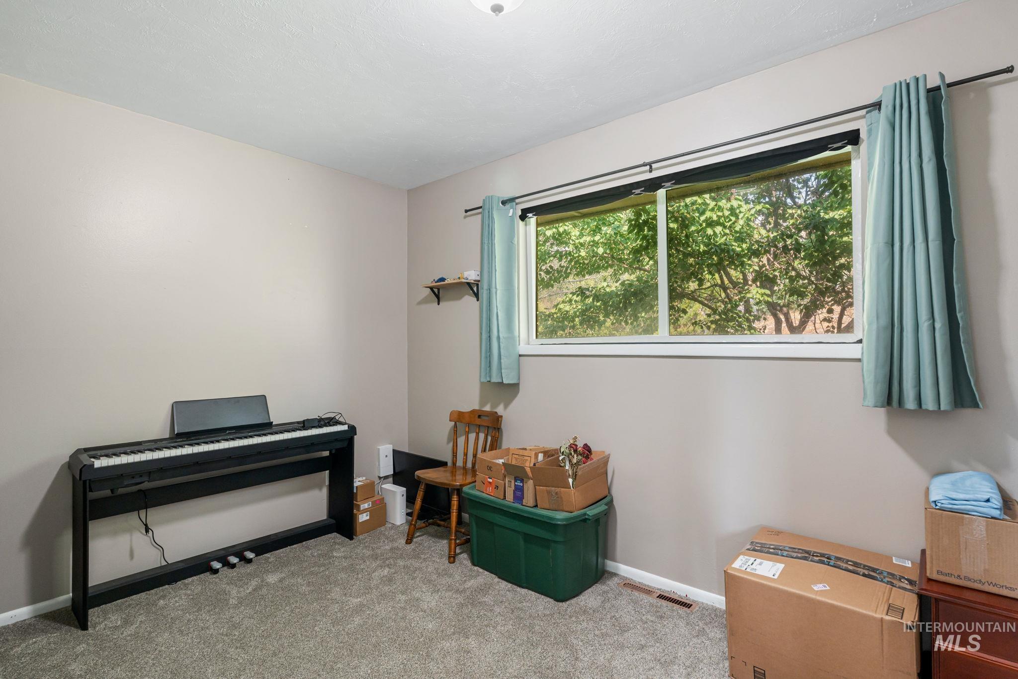 816 Park Lane Pocatello, ID 83201 - Photo 18 of 48 Misc room with carpet and baseboards