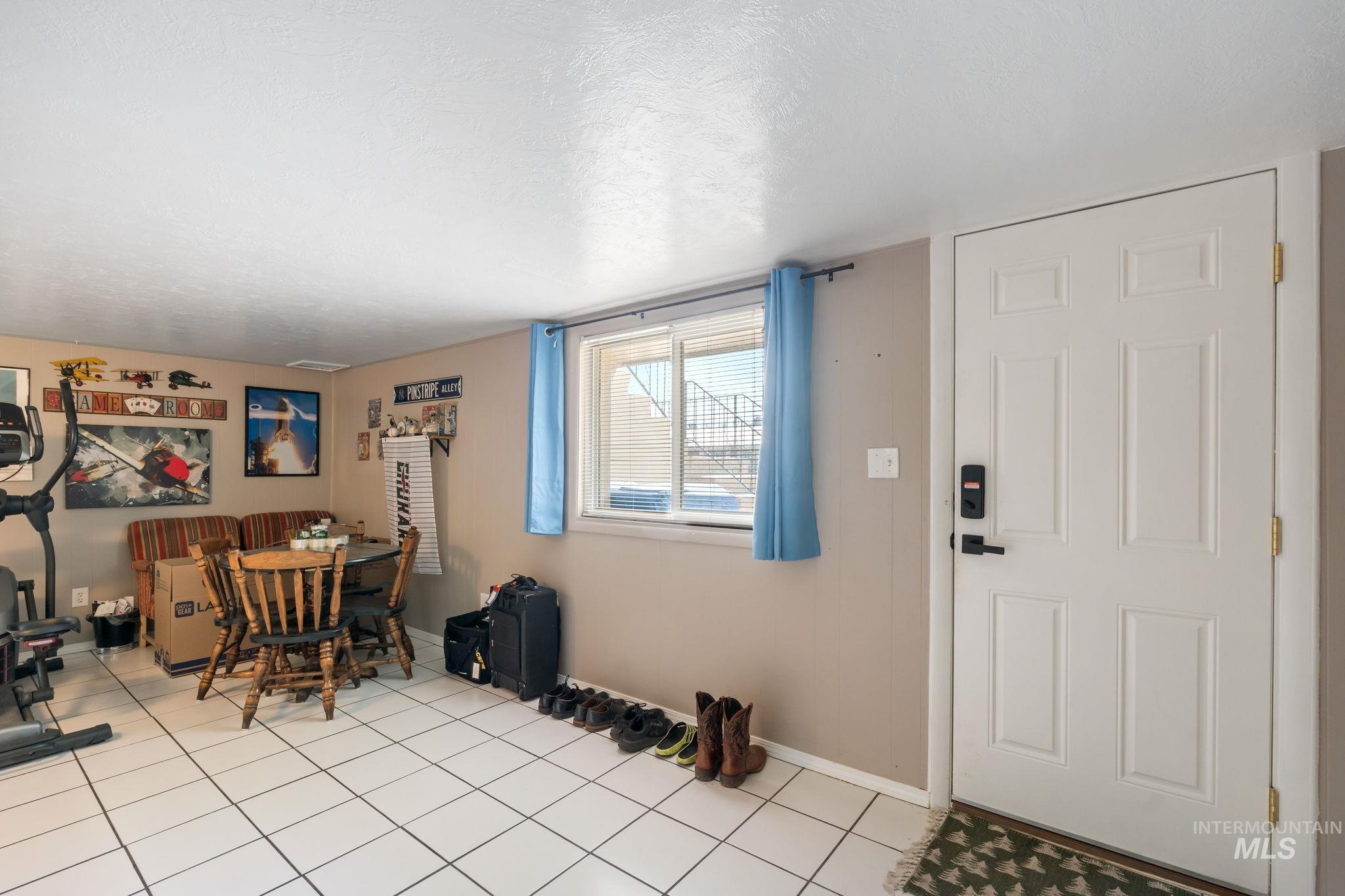 816 Park Lane Pocatello, ID 83201 - Photo 23 of 48 Dining area with light tile patterned floors and a textured ceiling