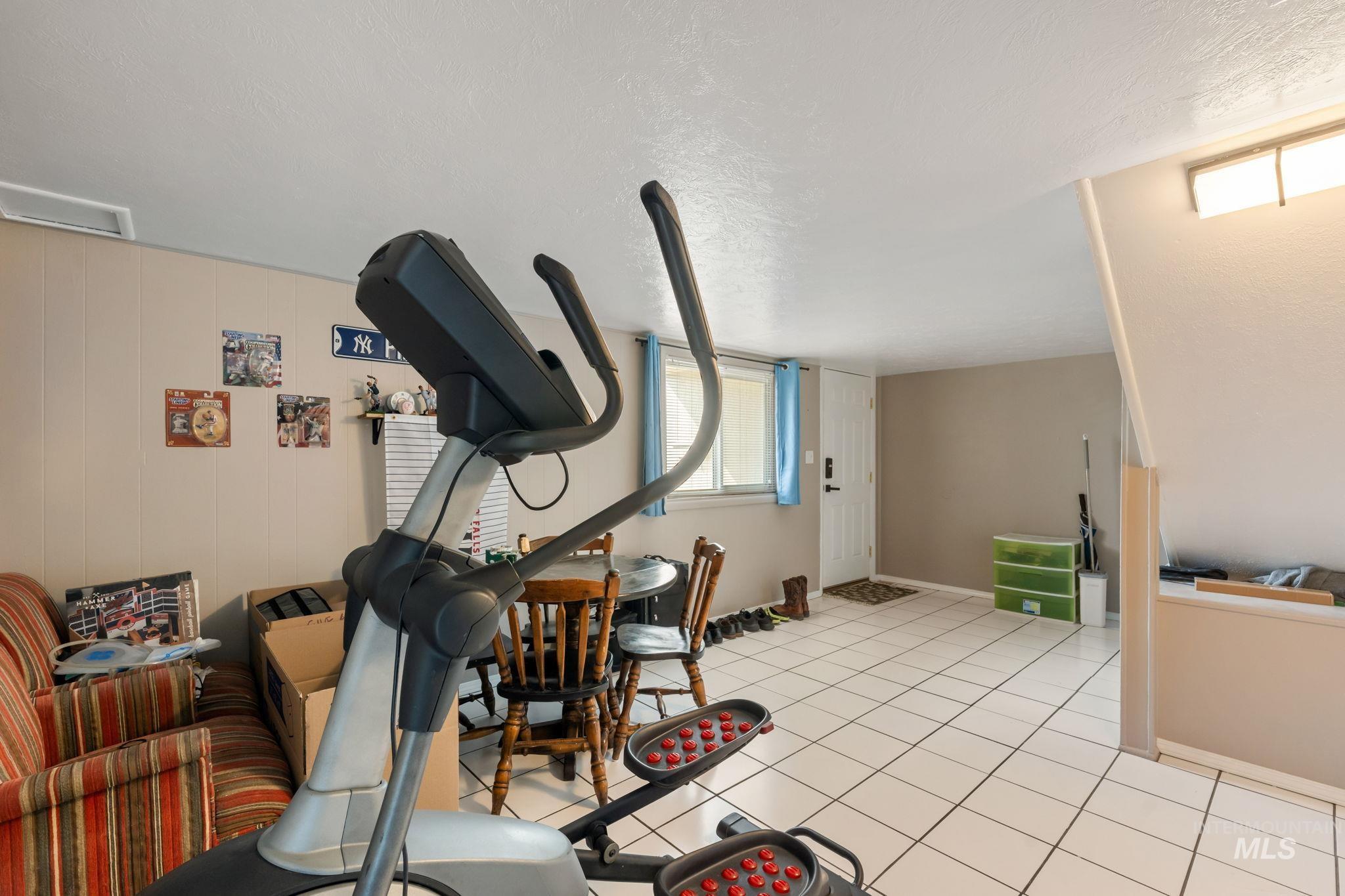 816 Park Lane Pocatello, ID 83201 - Photo 25 of 48 Exercise room with light tile patterned flooring and a textured ceiling