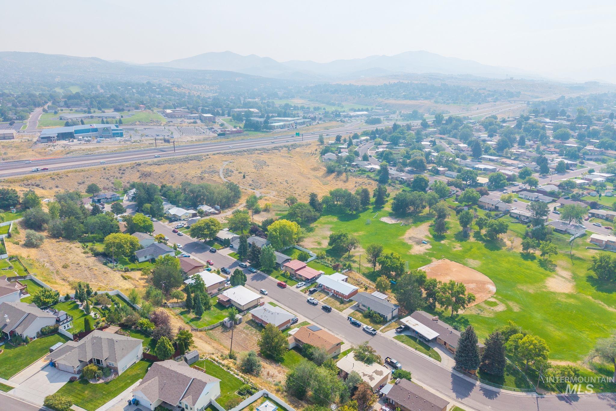 816 Park Lane Pocatello, ID 83201 - Photo 48 of 48 Aerial view of property and surrounding area featuring a mountainous background and nearby suburban area