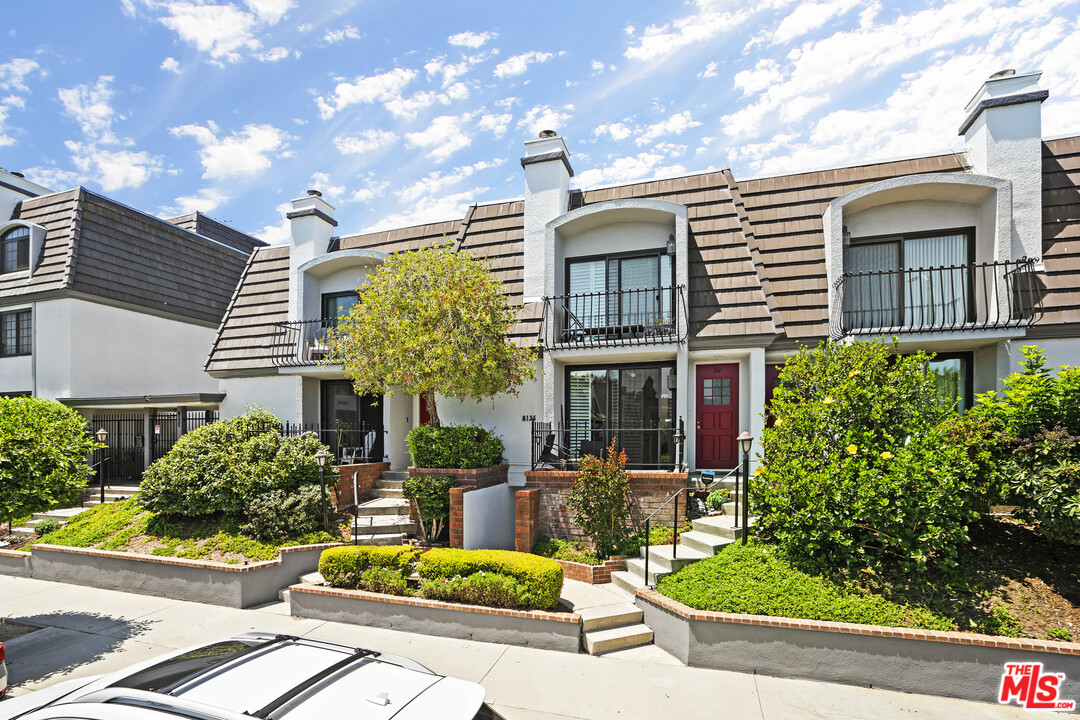 8135 Redlands Street, Unit 101 Playa del Rey, CA 90293 - Photo 1 of 42 a front view of a house with garden