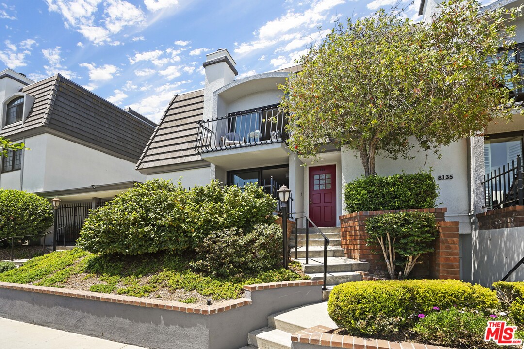 8135 Redlands Street, Unit 101 Playa del Rey, CA 90293 - Photo 2 of 42 a front view of a house with garden
