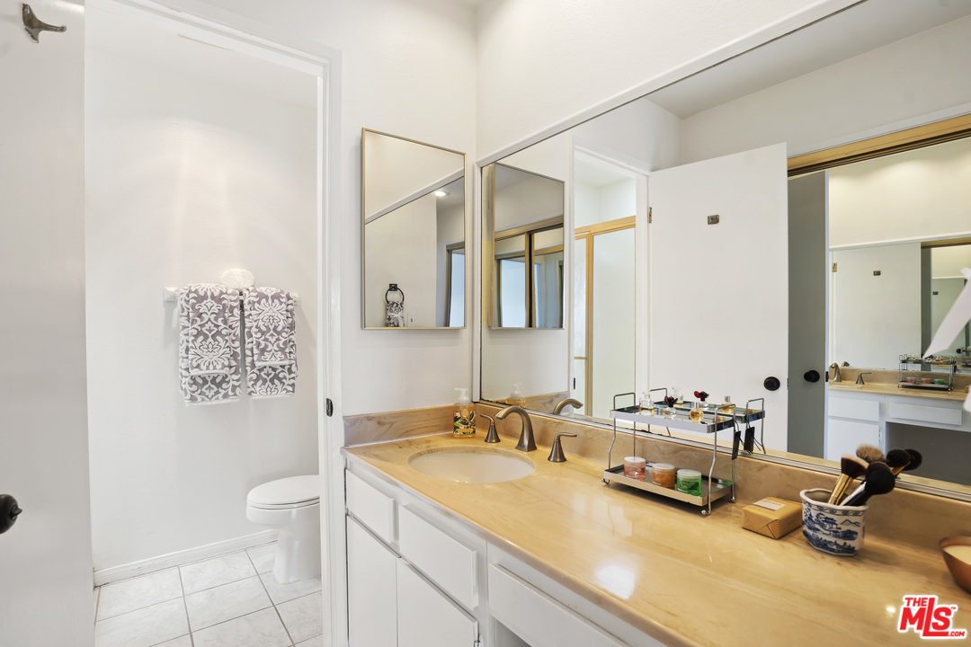 8135 Redlands Street, Unit 101 Playa del Rey, CA 90293 - Photo 27 of 42 a bathroom with a sink double vanity and a mirror
