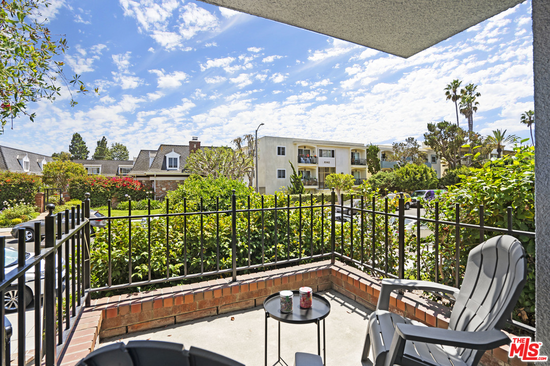 8135 Redlands Street, Unit 101 Playa del Rey, CA 90293 - Photo 30 of 42 a view of a chairs and table in the balcony