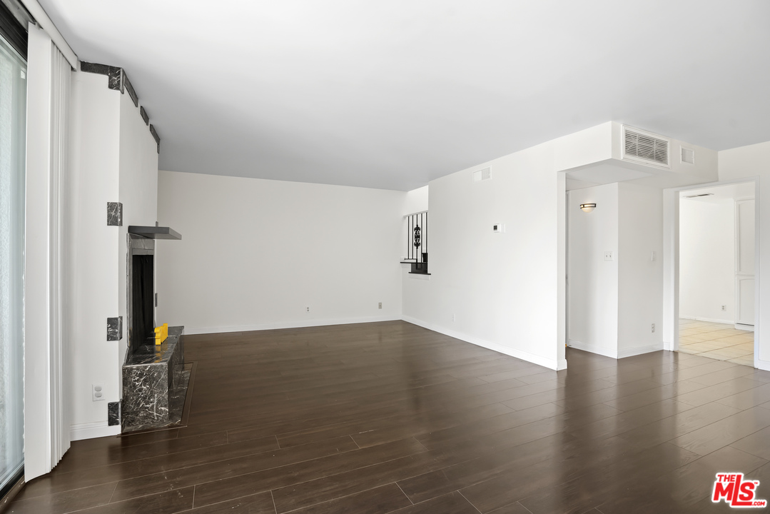 8135 Redlands Street, Unit 101 Playa del Rey, CA 90293 - Photo 5 of 42 a view of a livingroom with wooden floor
