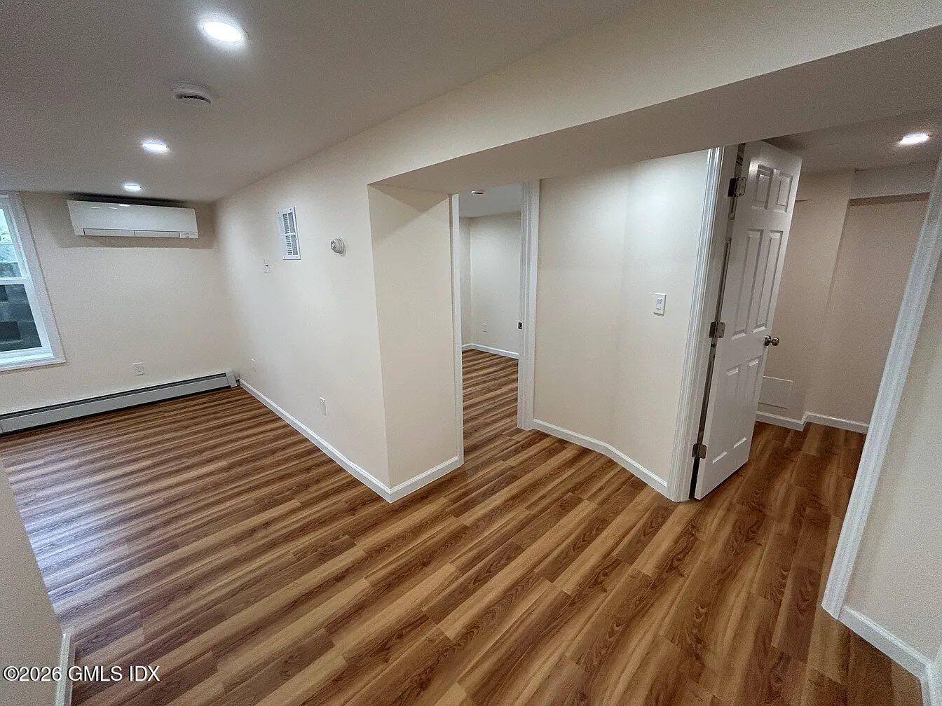 90 Havemeyer Lane, Unit 2 Greenwich, CT 06870 - Photo 9 of 19 hallway to br and bonus room