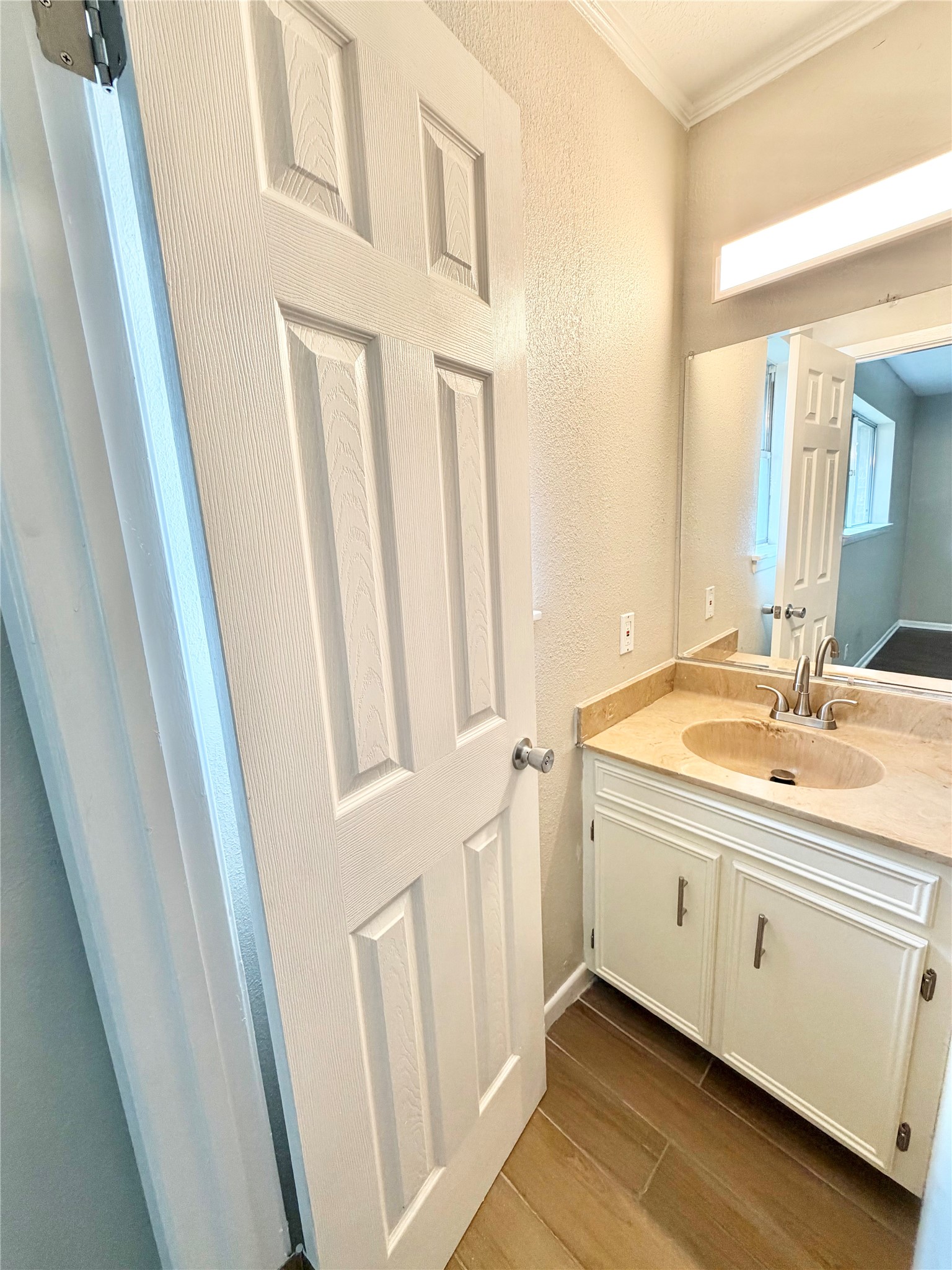 98 Sparrow Way Beaumont, TX 77707 - Photo 12 of 25 a bathroom with a double vanity sink and a mirror