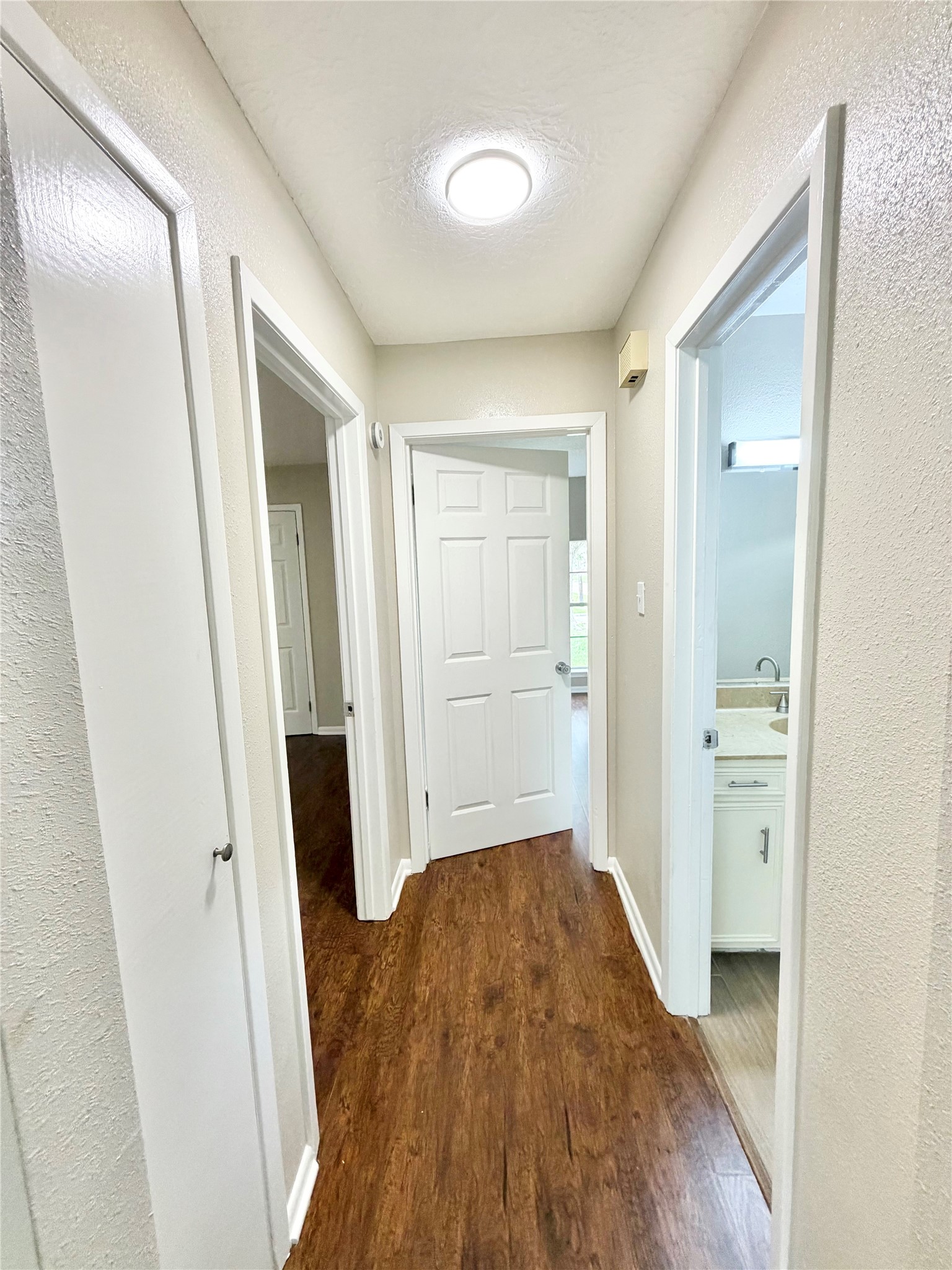 98 Sparrow Way Beaumont, TX 77707 - Photo 16 of 25 a view of a hallway with wooden floor and closet area