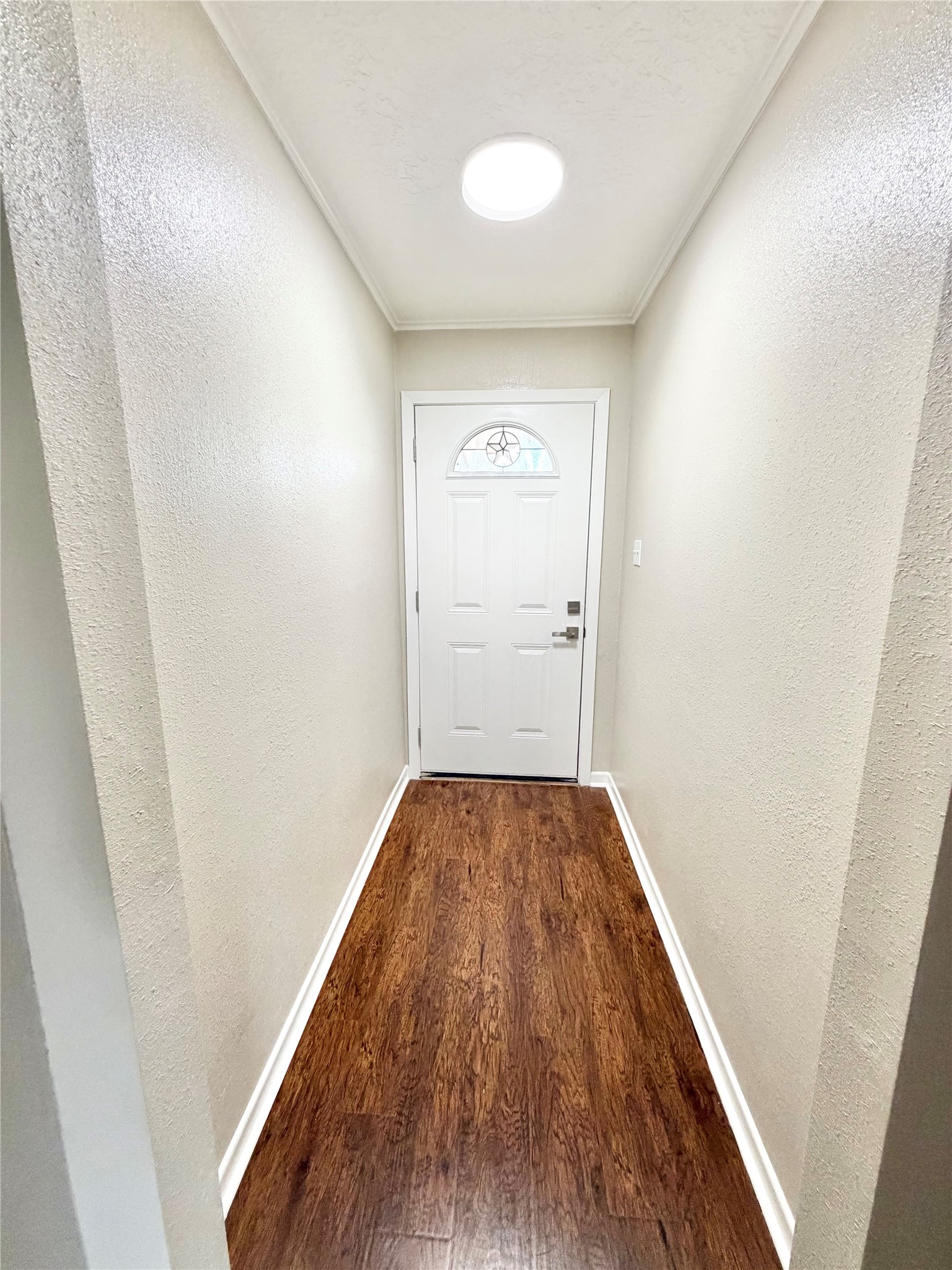 98 Sparrow Way Beaumont, TX 77707 - Photo 17 of 25 a view of a hallway with wooden floor