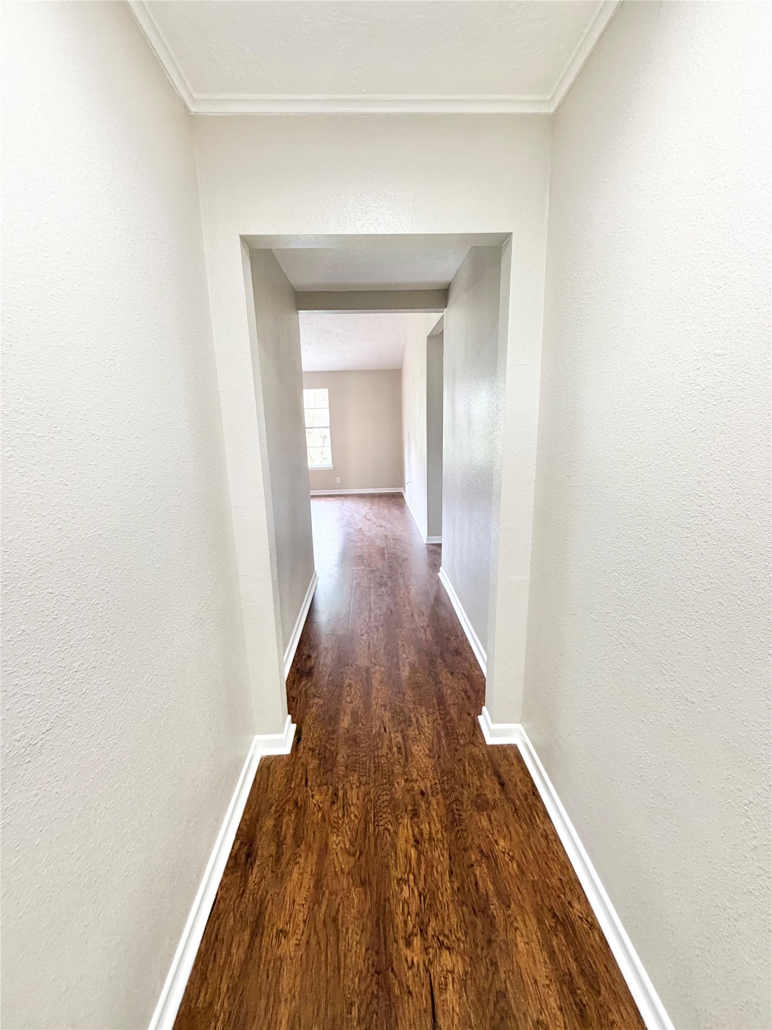 98 Sparrow Way Beaumont, TX 77707 - Photo 2 of 25 a view of a hallway with wooden floor