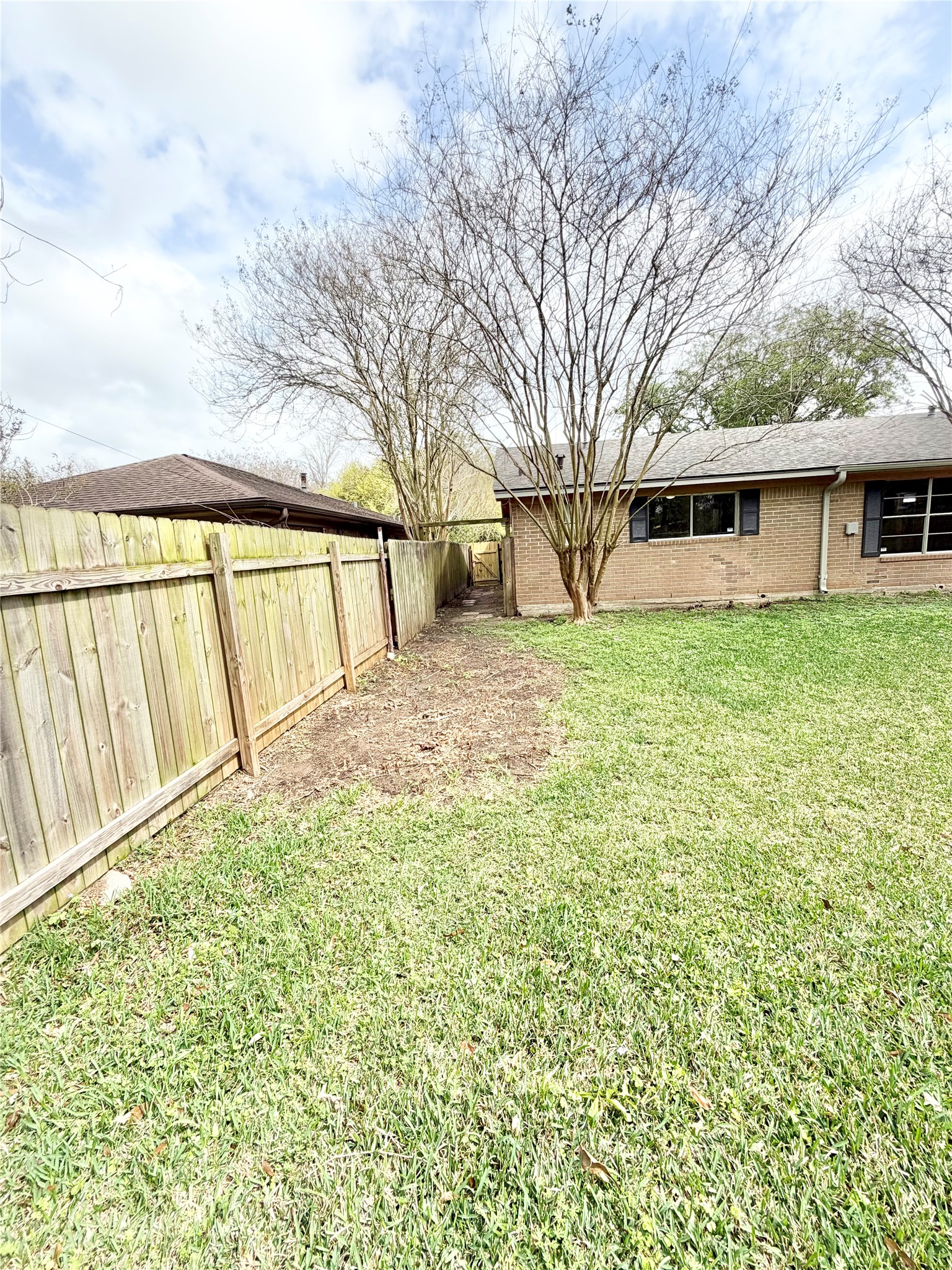 98 Sparrow Way Beaumont, TX 77707 - Photo 22 of 25 a view of a yard with a house