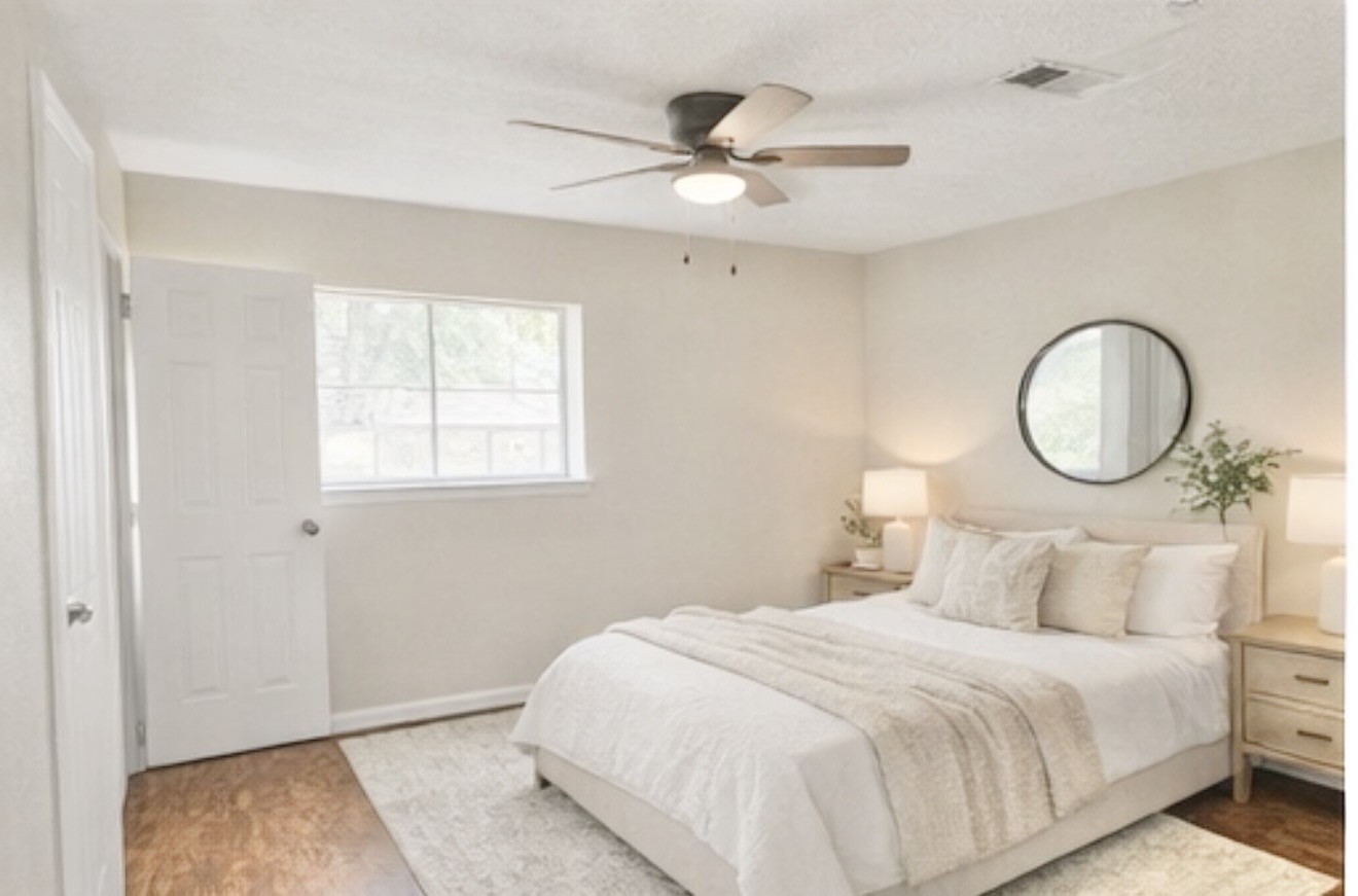 98 Sparrow Way Beaumont, TX 77707 - Photo 24 of 25 a bedroom with a bed and a window