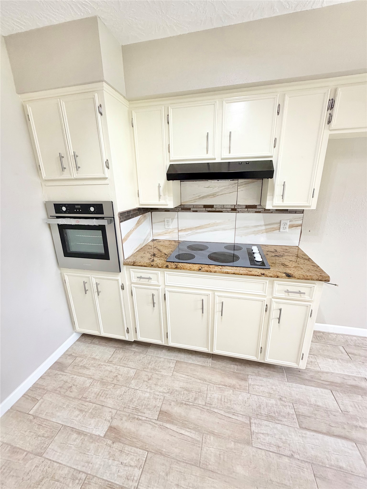 98 Sparrow Way Beaumont, TX 77707 - Photo 8 of 25 a kitchen with granite countertop a stove a sink and a granite counter tops