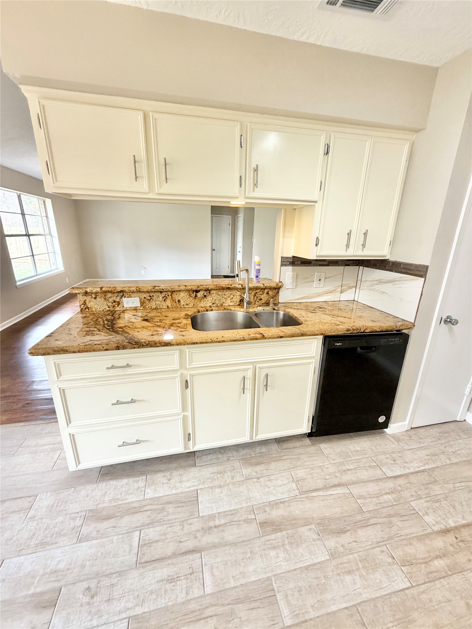 98 Sparrow Way Beaumont, TX 77707 - Photo 9 of 25 a kitchen with stainless steel appliances granite countertop a sink stove and cabinets