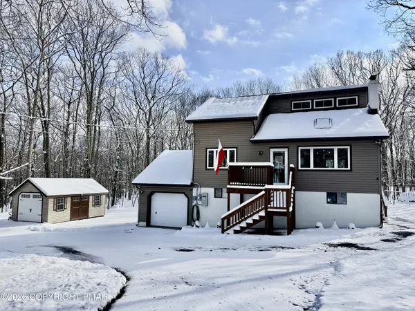 a front view of a house with parking yard