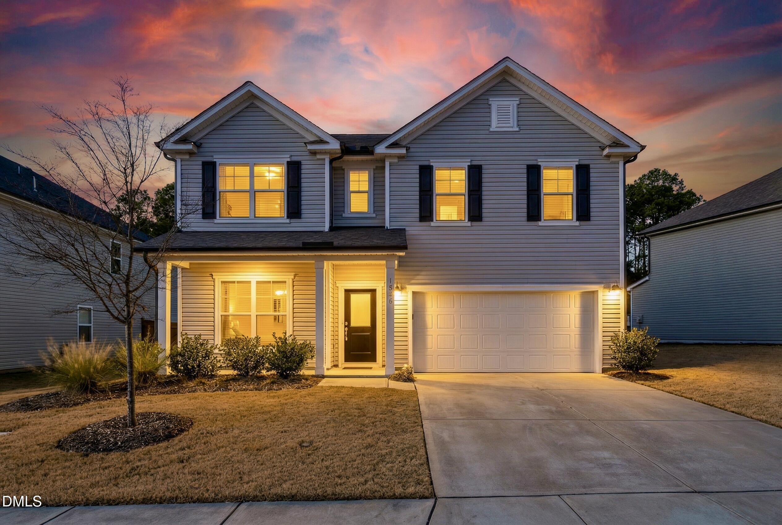 1018 Flyfish Avenue Durham, NC 27703 - Photo 1 of 54 a front view of a house with a yard