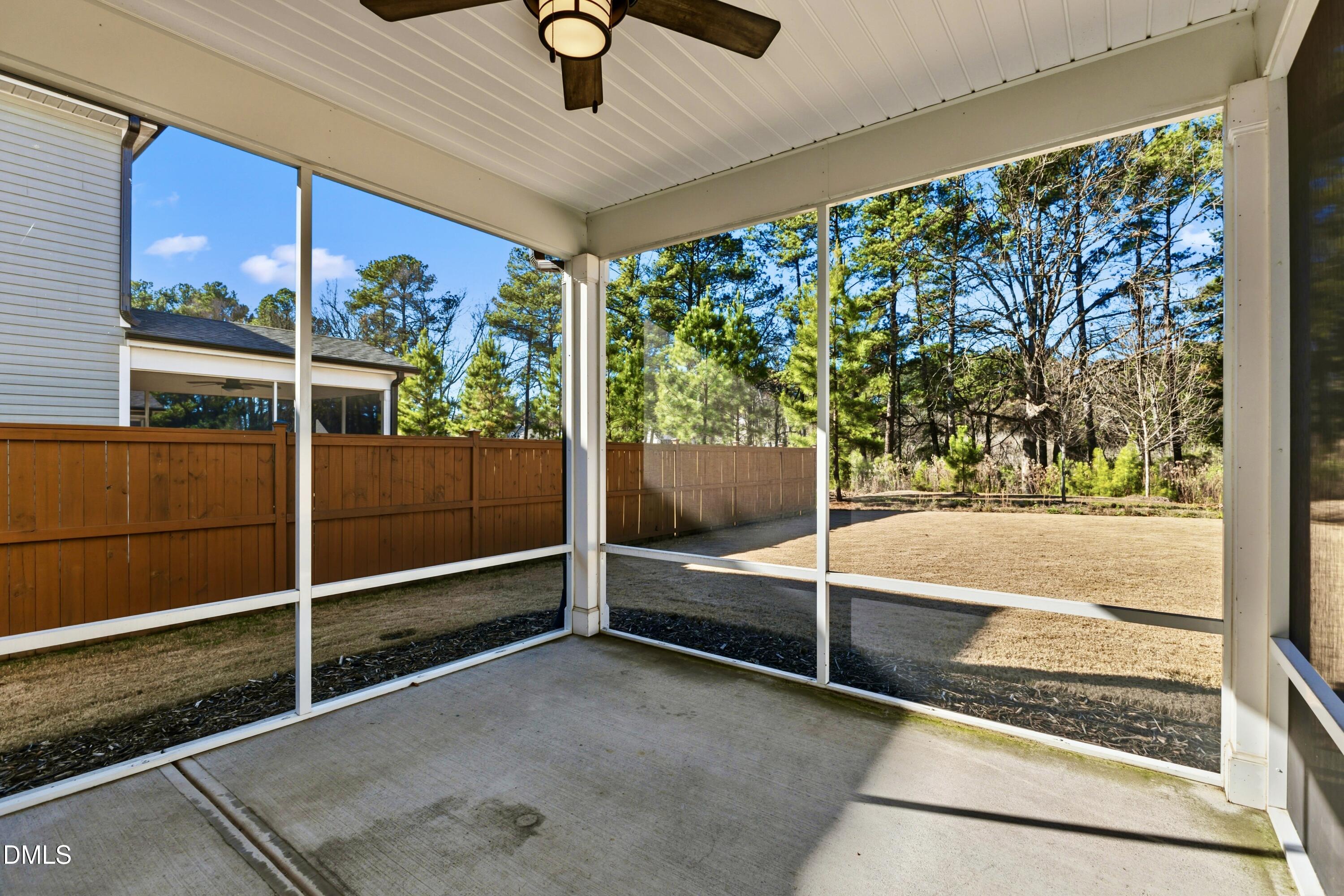 1018 Flyfish Avenue Durham, NC 27703 - Photo 19 of 54 a view of a room with gym equipment and large windows