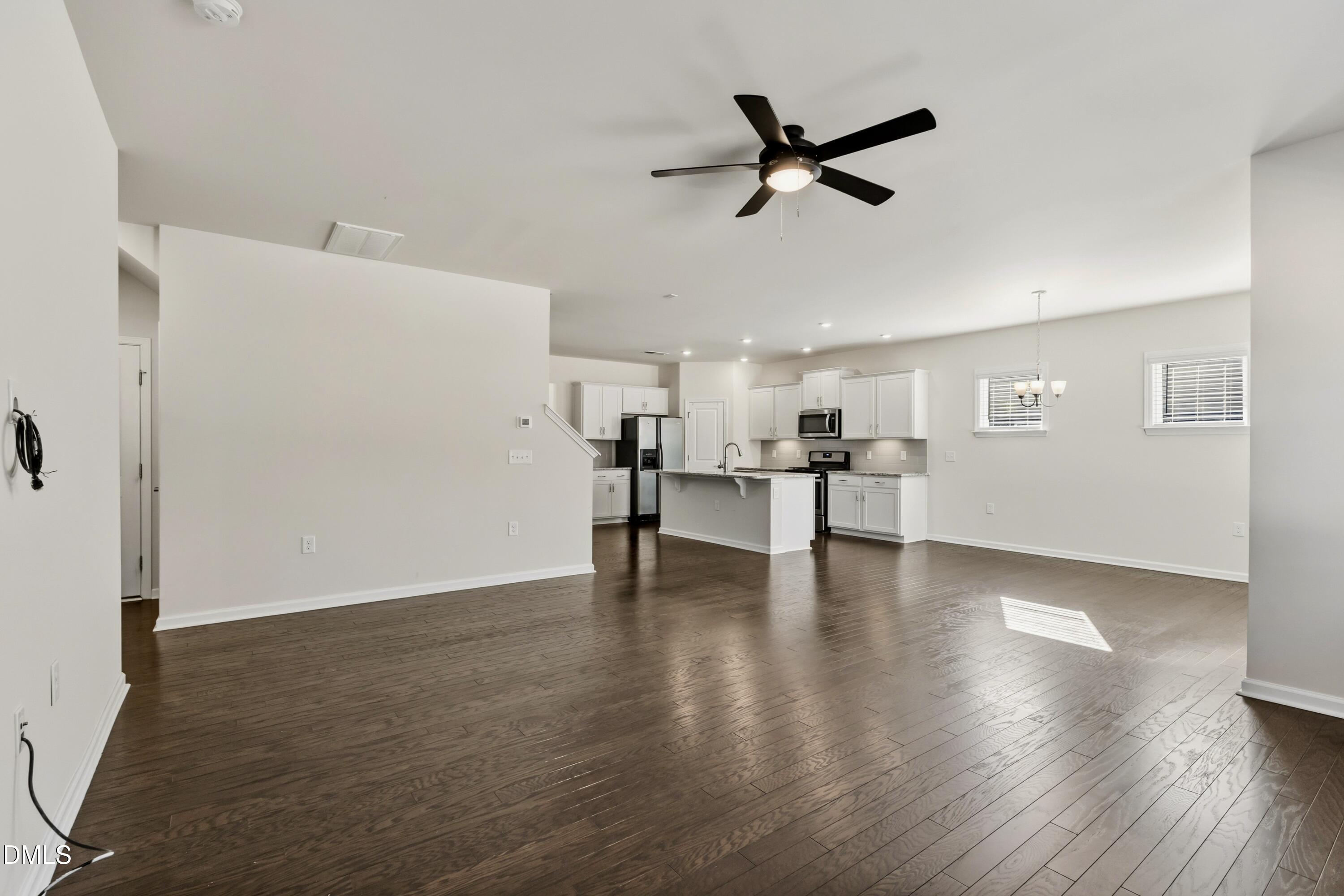 1018 Flyfish Avenue Durham, NC 27703 - Photo 23 of 54 a view of work space with wooden floor and ceiling fan