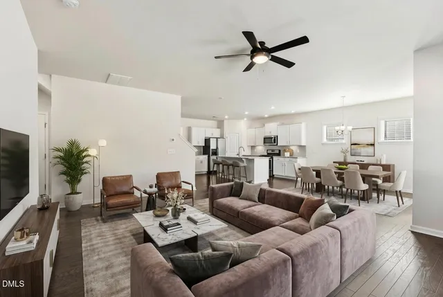 a bathroom with a granite countertop sink a toilet and a mirror