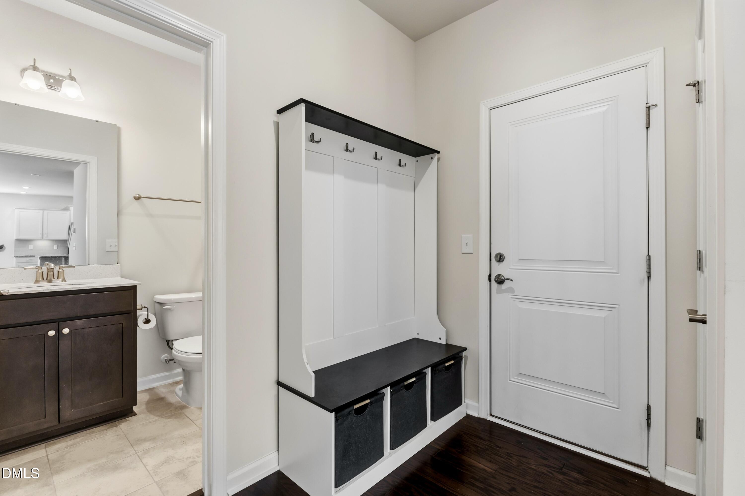 1018 Flyfish Avenue Durham, NC 27703 - Photo 27 of 54 a view of bathroom with a toilet a sink and a mirror