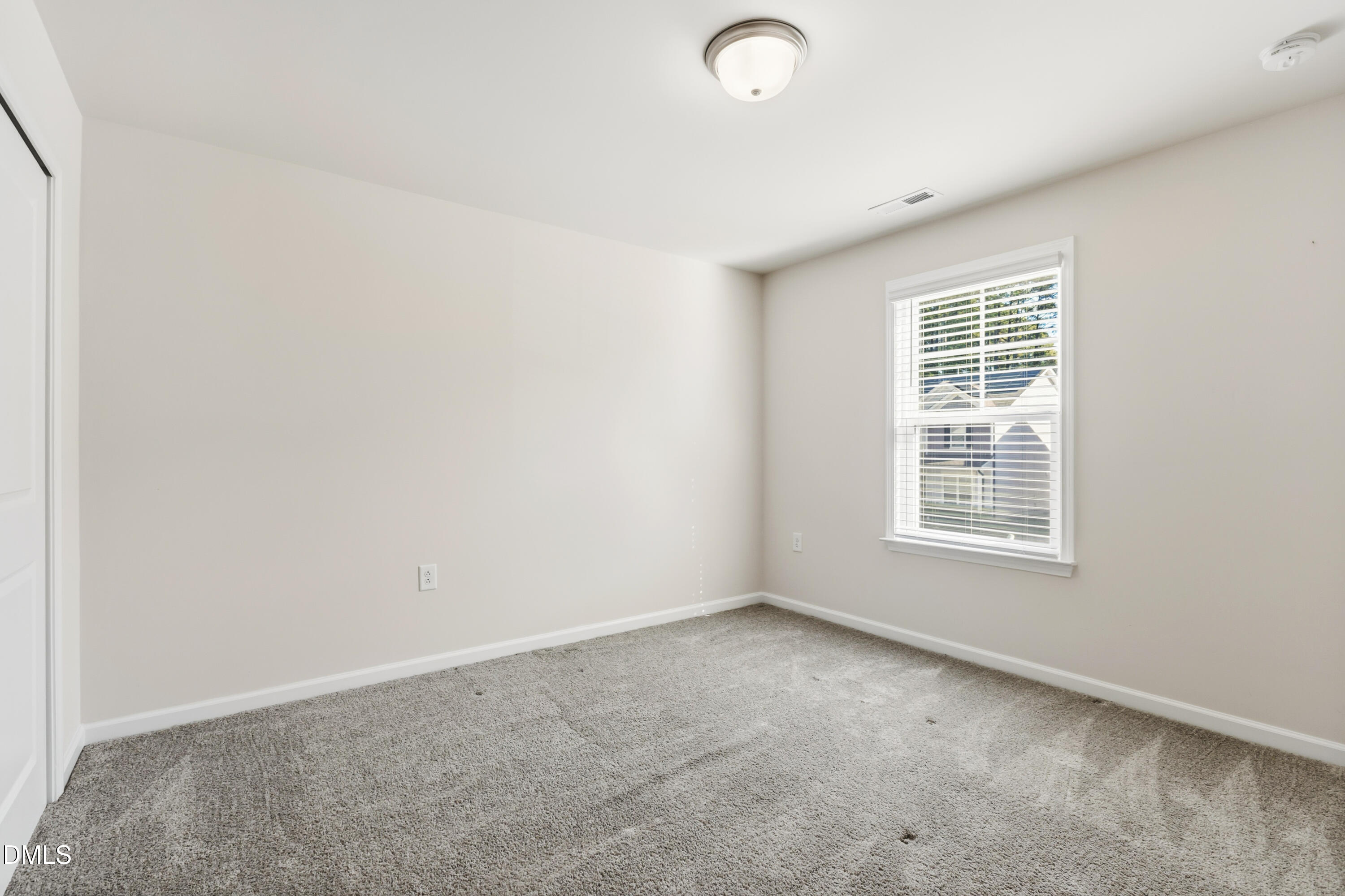 1018 Flyfish Avenue Durham, NC 27703 - Photo 42 of 54 an empty room with a window