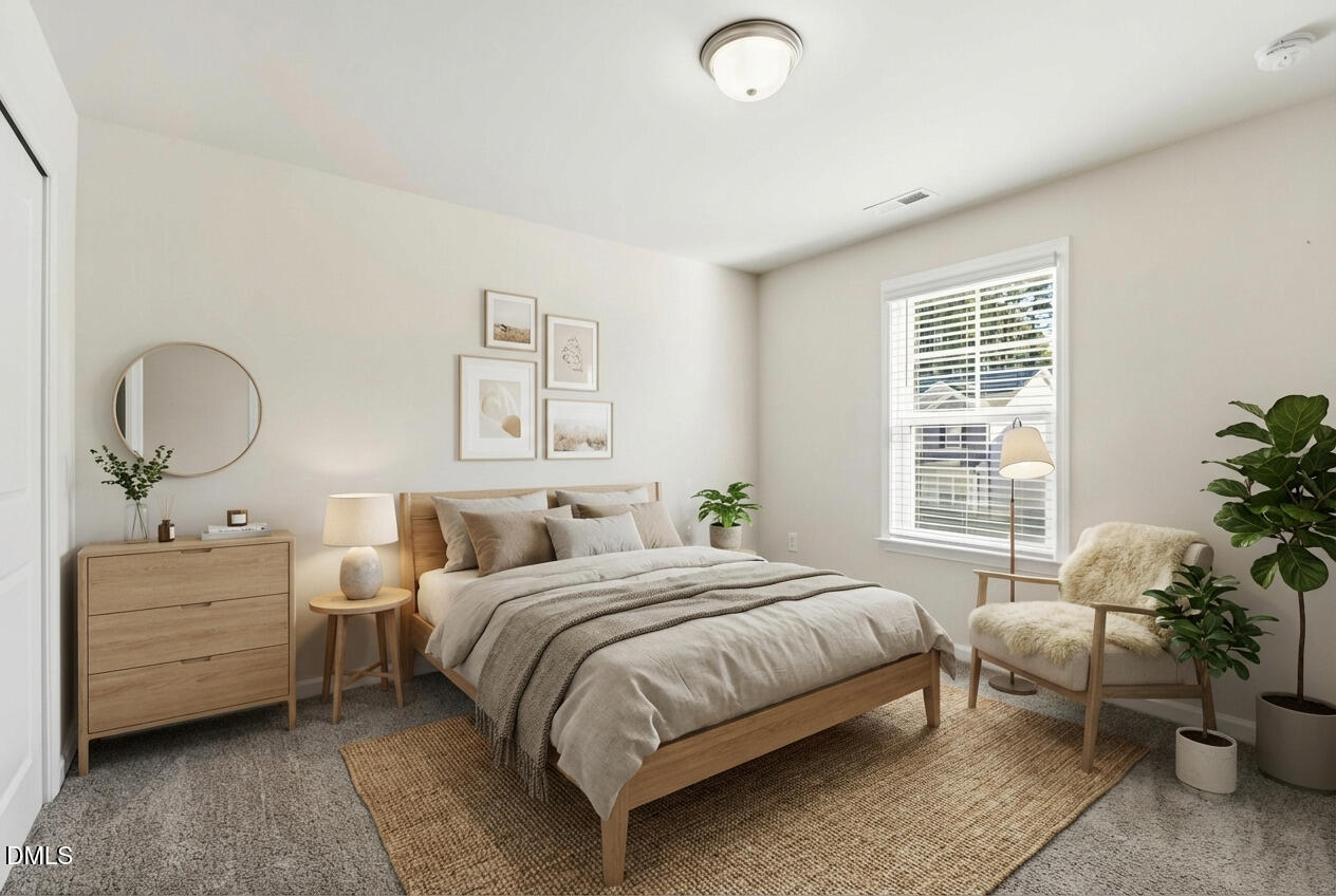 1018 Flyfish Avenue Durham, NC 27703 - Photo 43 of 54 a bedroom with a bed and window