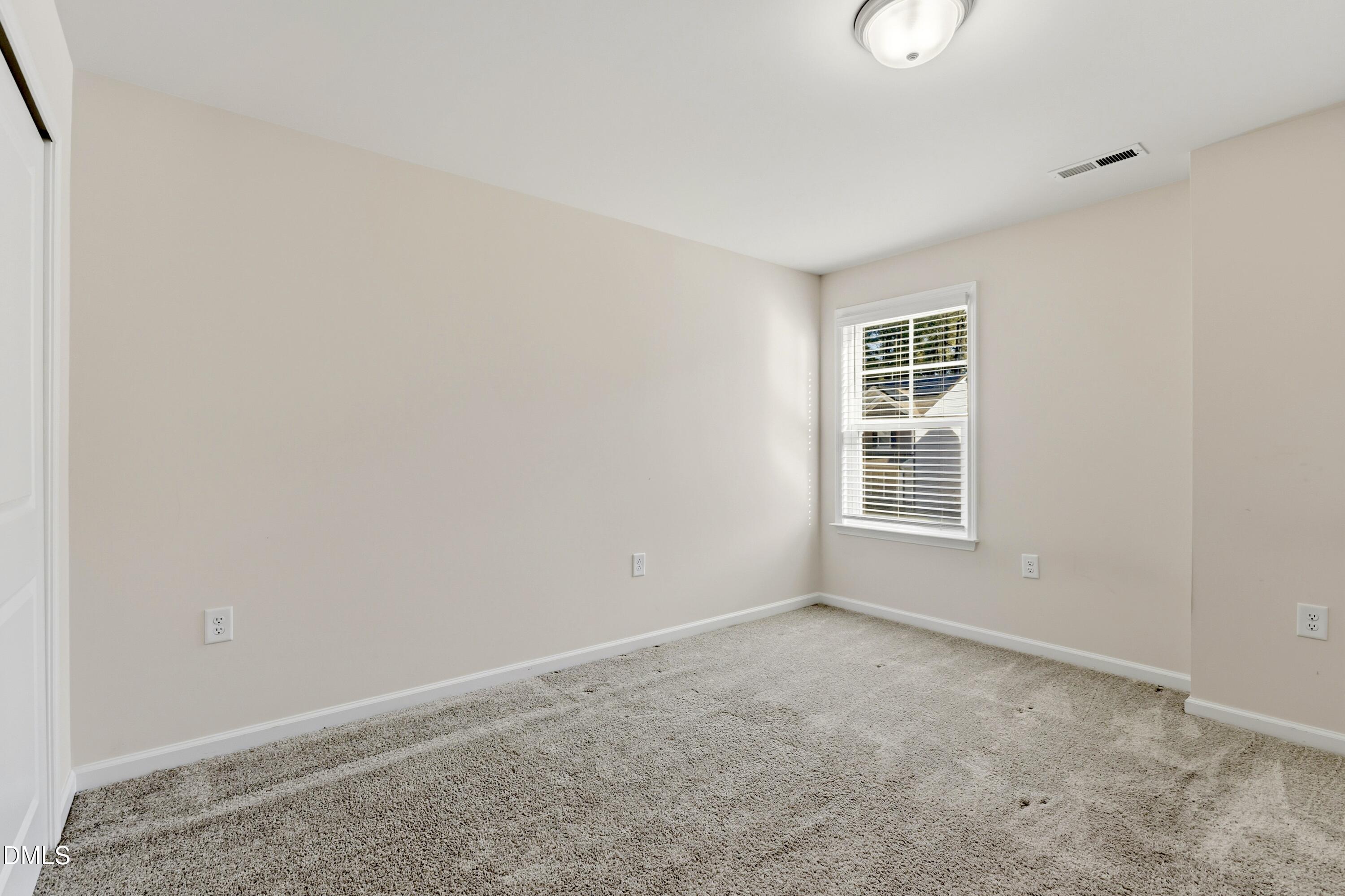 1018 Flyfish Avenue Durham, NC 27703 - Photo 45 of 54 an empty room with windows