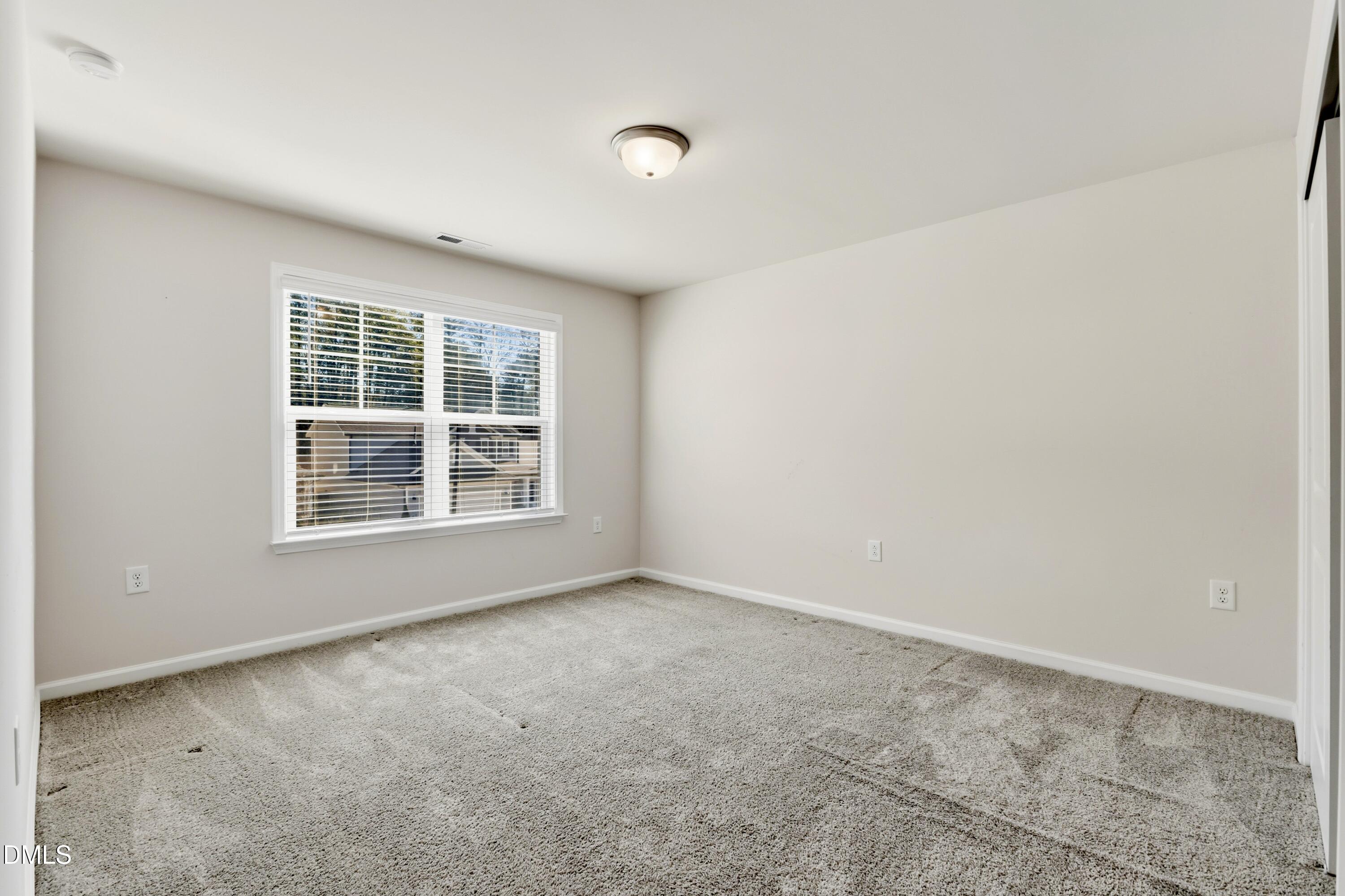 1018 Flyfish Avenue Durham, NC 27703 - Photo 47 of 54 an empty room with a window