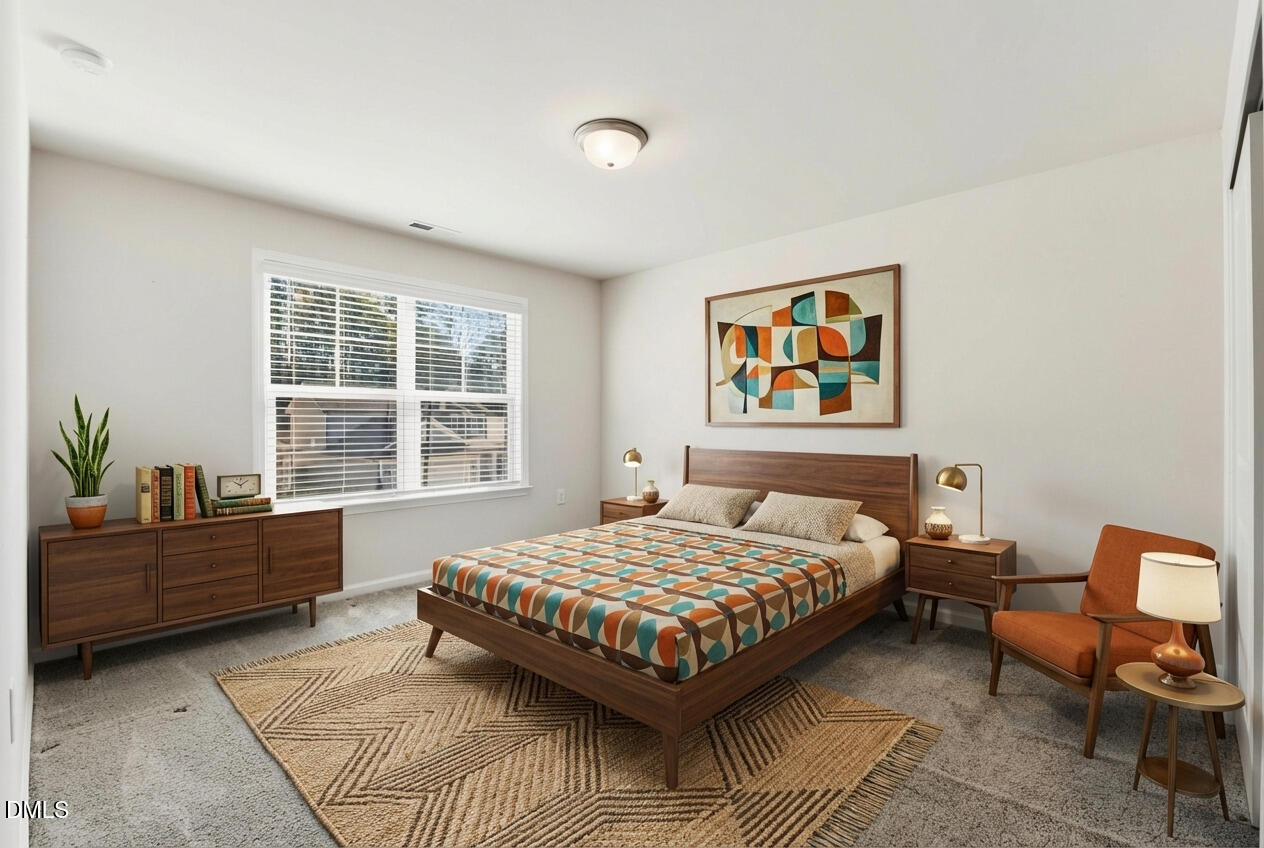 1018 Flyfish Avenue Durham, NC 27703 - Photo 48 of 54 a bedroom with a bed and window