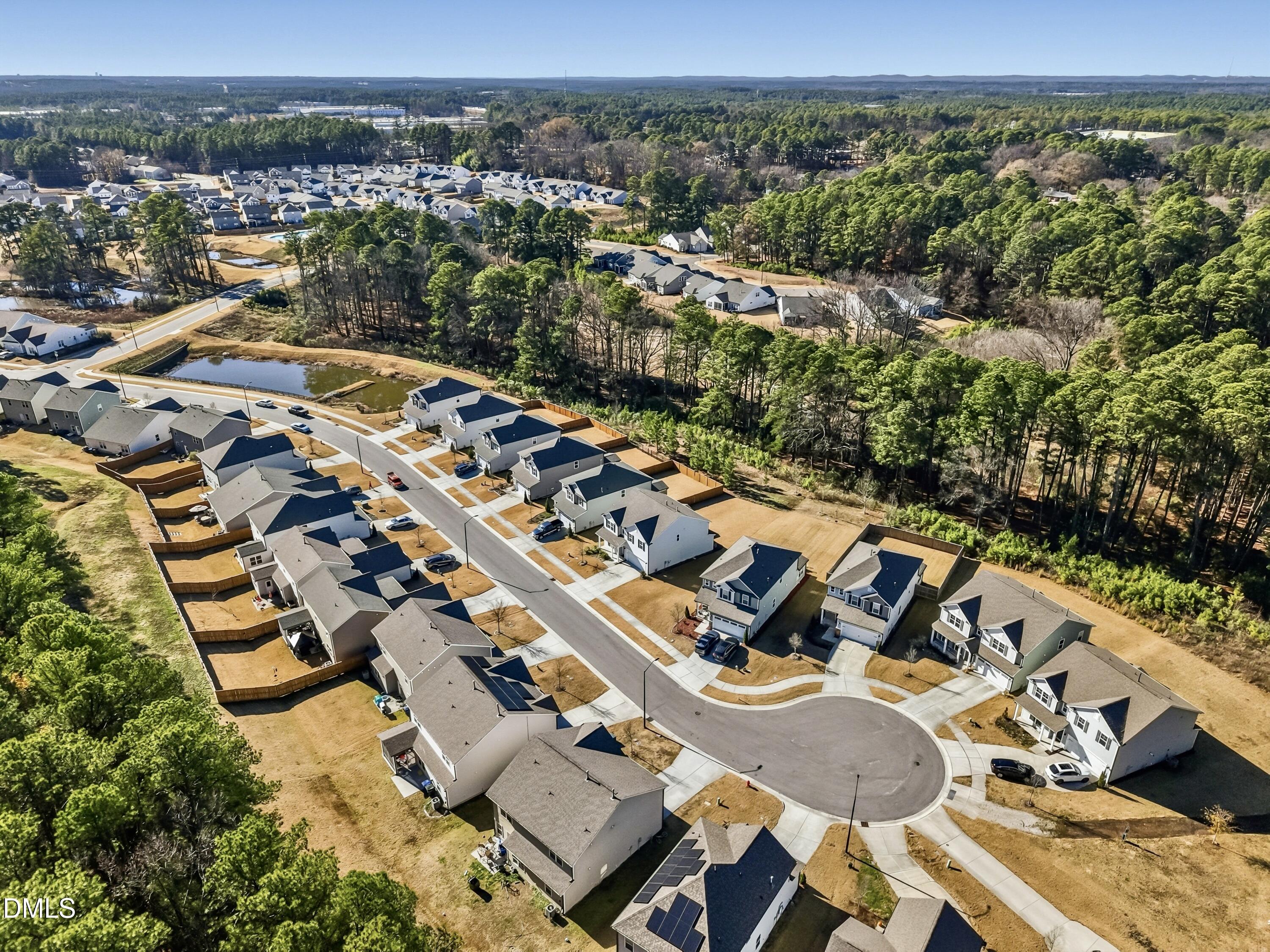 1018 Flyfish Avenue Durham, NC 27703 - Photo 5 of 54 an aerial view of residential houses with outdoor space