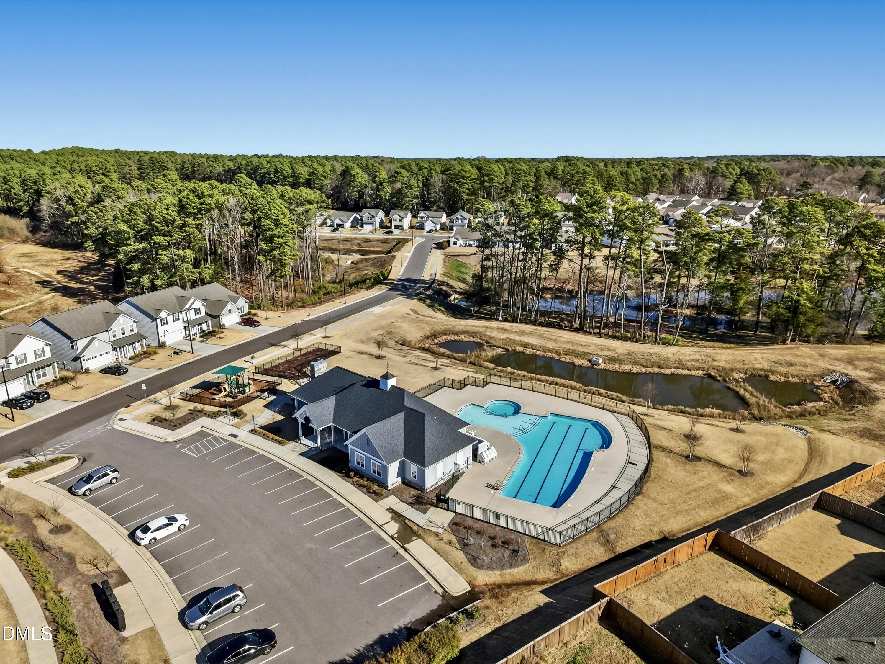 1018 Flyfish Avenue Durham, NC 27703 - Photo 53 of 54 a view of a swimming pool with lawn chairs