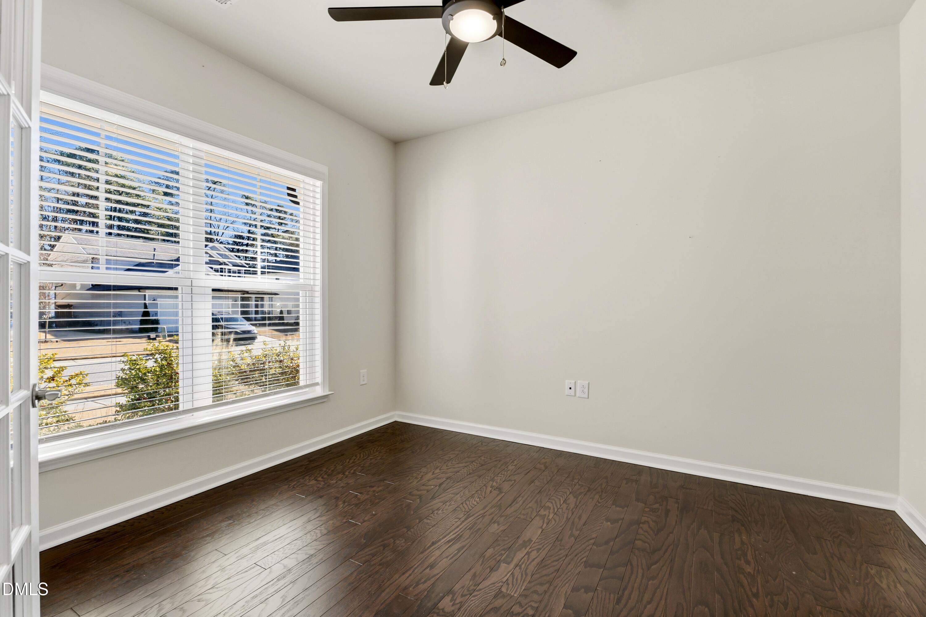 1018 Flyfish Avenue Durham, NC 27703 - Photo 10 of 54 wooden floor in an empty room with a window