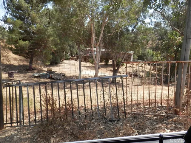 a view of a house with a snow on the road