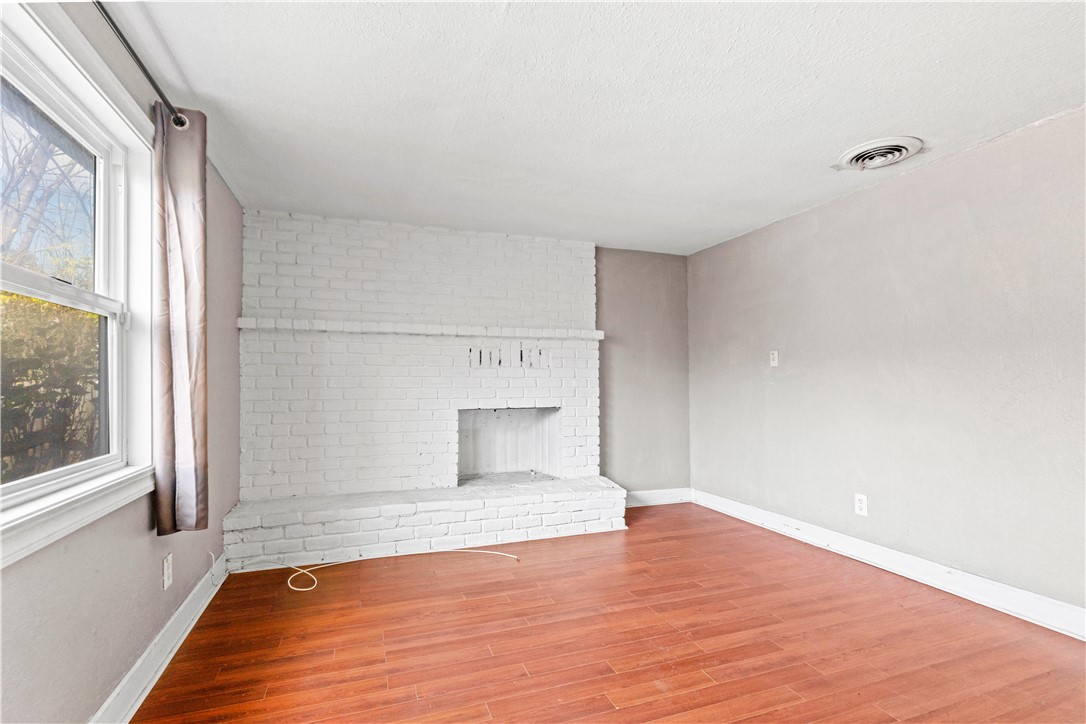 4073 Cedar Street Riverside, CA 92501 - Photo 27 of 46 a view of empty room with wooden floor and fan