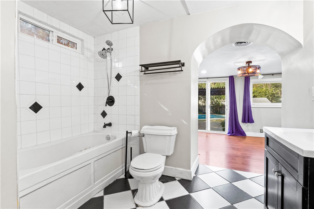 4073 Cedar Street Riverside, CA 92501 - Photo 34 of 46 a bathroom with a toilet a sink and bathtub