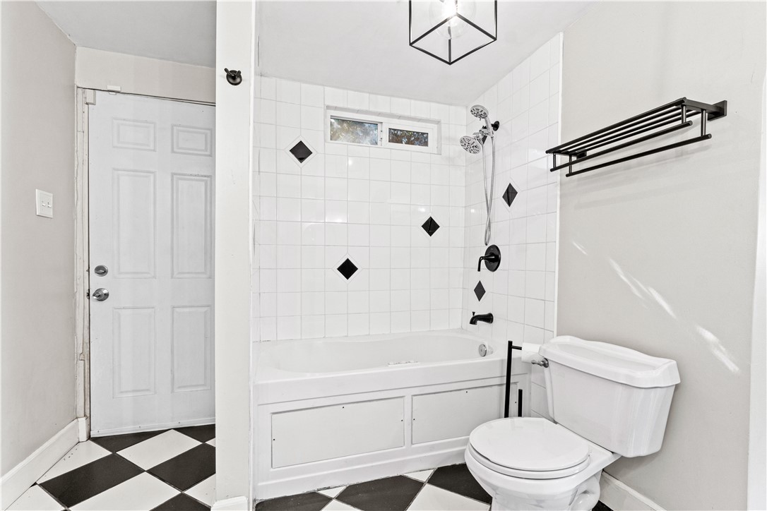 4073 Cedar Street Riverside, CA 92501 - Photo 35 of 46 a bathroom with a toilet and a shower