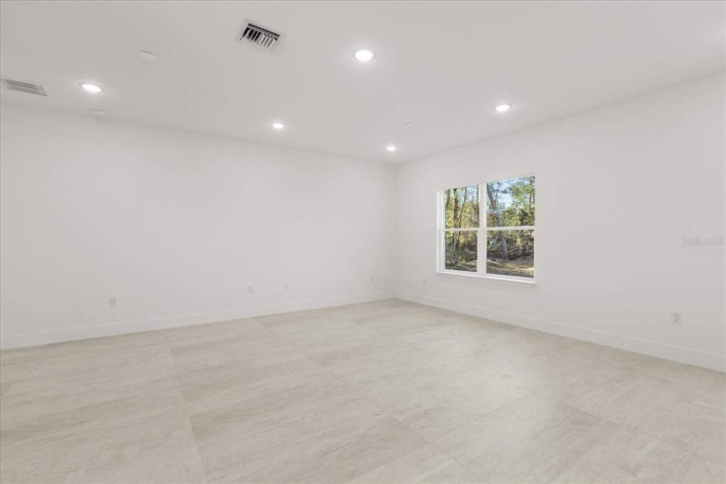 6168 Southwest 154th Street Ocala, FL 34473 - Photo 11 of 33 an empty room with windows and closet