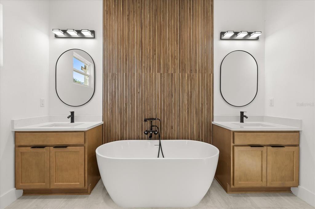 6168 Southwest 154th Street Ocala, FL 34473 - Photo 20 of 33 a bathroom with a sink a mirror and a toilet