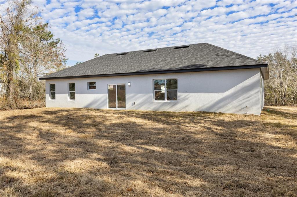 6168 Southwest 154th Street Ocala, FL 34473 - Photo 28 of 33 a front view of a house with yard