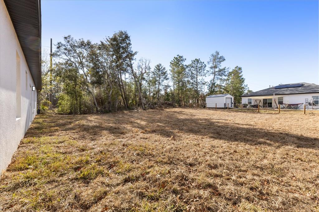 6168 Southwest 154th Street Ocala, FL 34473 - Photo 29 of 33 a view of a house with a yard
