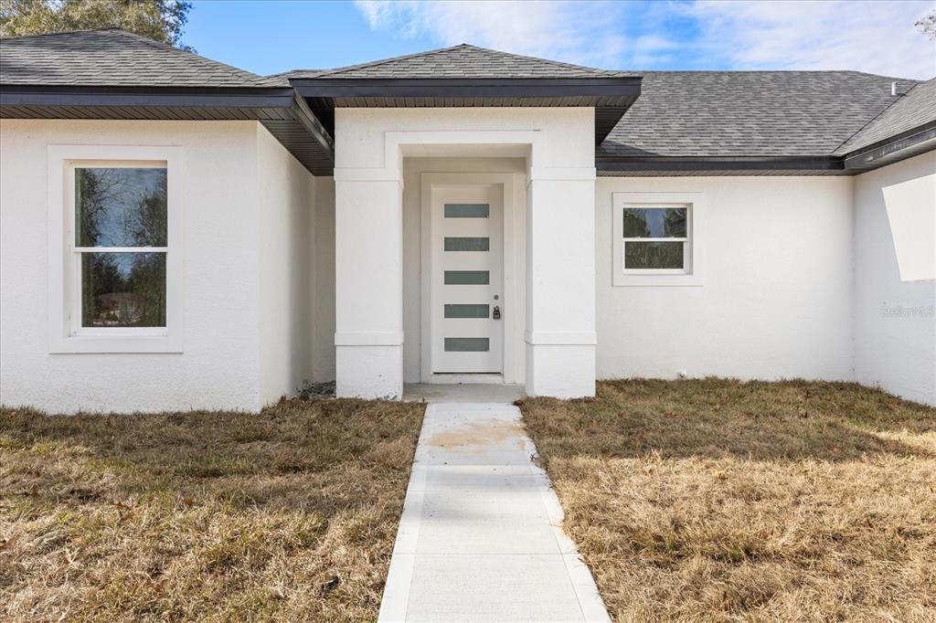 6168 Southwest 154th Street Ocala, FL 34473 - Photo 6 of 33 a front view of a house
