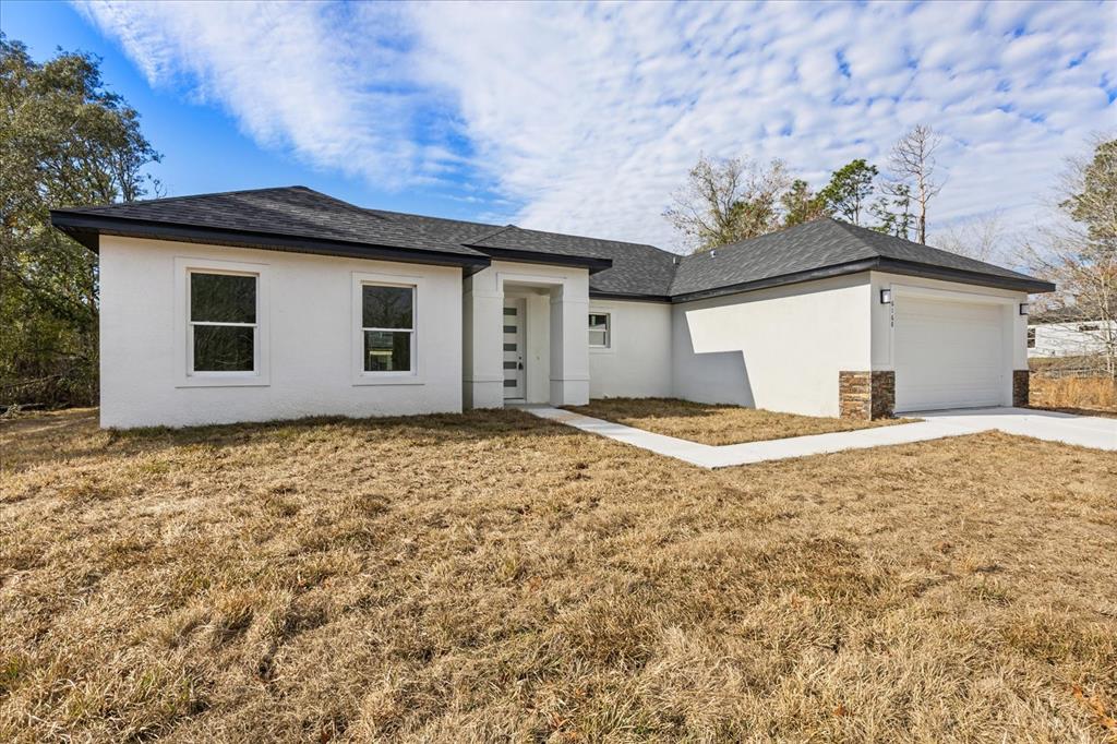6168 Southwest 154th Street Ocala, FL 34473 - Photo 7 of 33 a view of a house with a yard