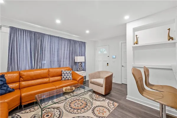 a blue room with furniture and a rug