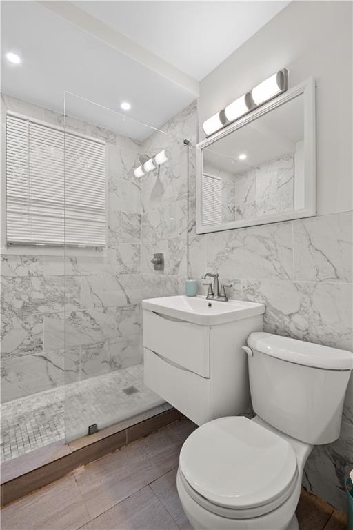 1738 Duke Road Atlanta, GA 30341 - Photo 17 of 23 a bathroom with a toilet a sink a mirror and shower