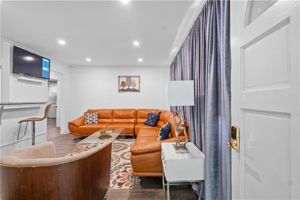 a bedroom with a bed and a couch