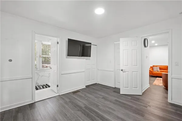 a view of a livingroom with wooden floor