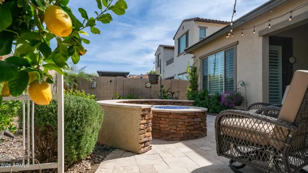 a view of an house with backyard porch and furniture