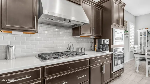a kitchen with a stove and a sink